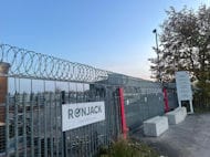 Razor Wire Fitted Above Steel Fence and Sliding Gate